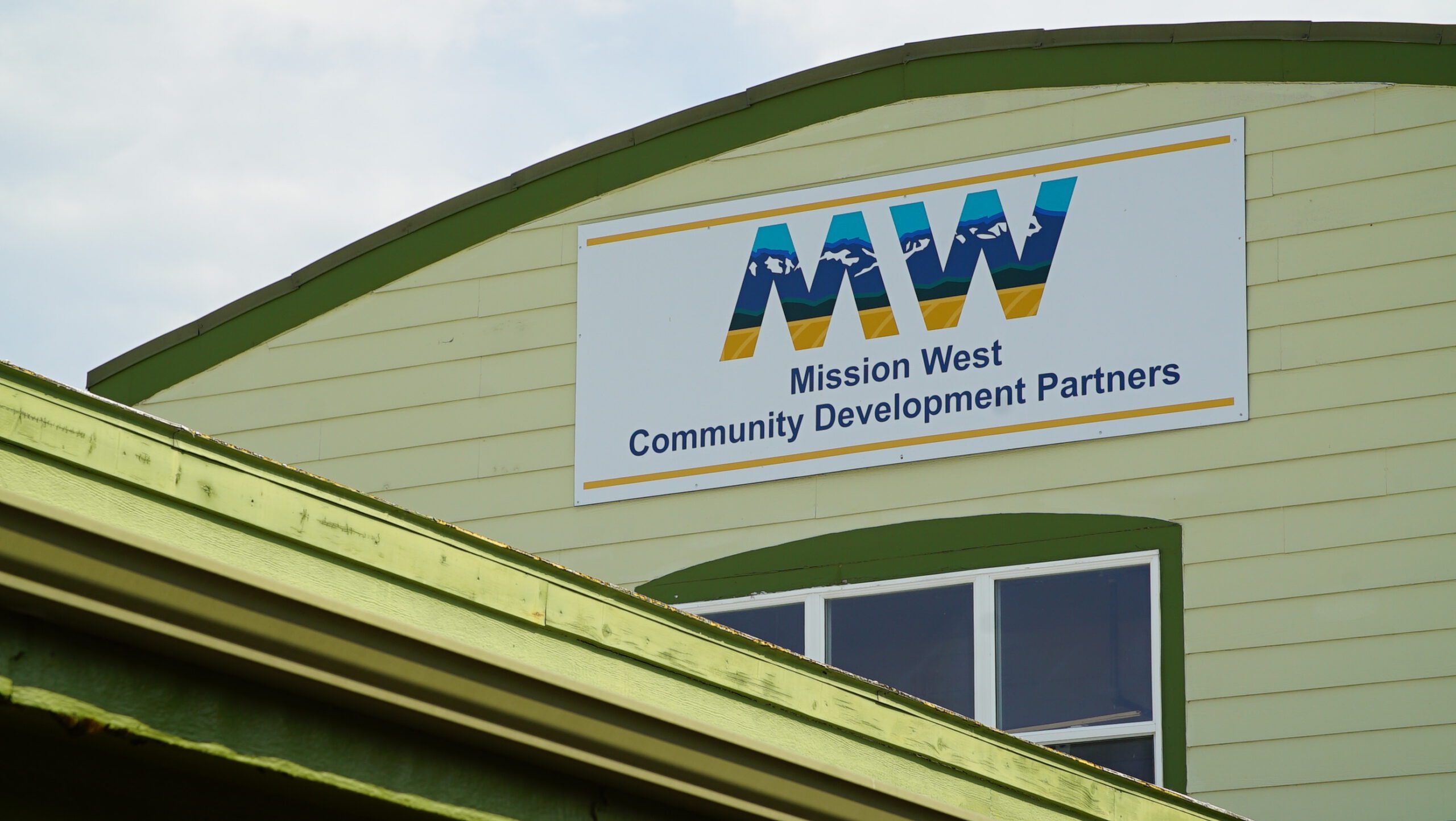 Exterior of the Mission West Community Development Partners office in Ronan with the MW sign