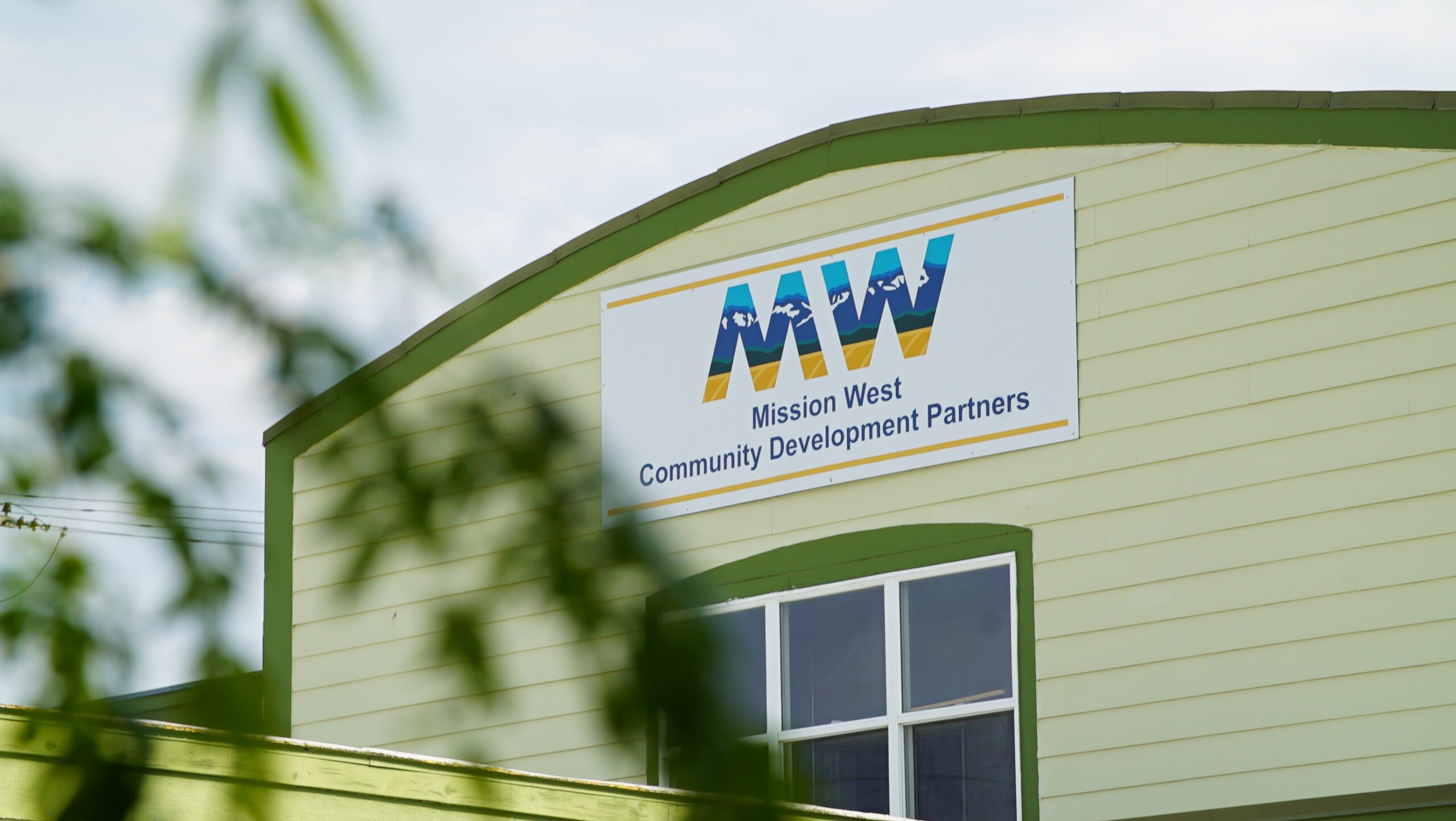 Exterior of the Mission West Community Development Partners office in Ronan, Montana, with the MW sign