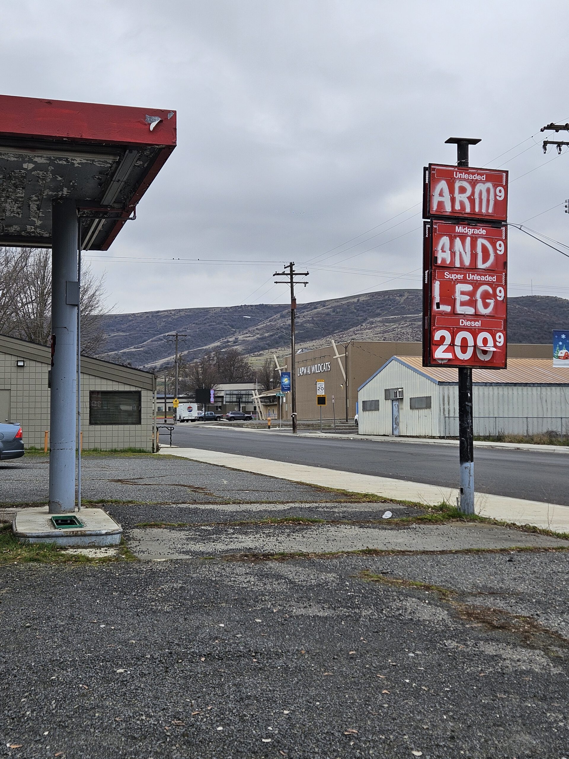 A vacant former gas station in a small Montana town, the kind of blighted property the Brownfields program assesses